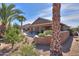 Landscaped backyard featuring lush trees, a fountain, and desert landscaping at 2408 E Fiesta Dr, Casa Grande, AZ 85194