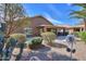 An inviting backyard showcasing desert landscaping and a charming covered patio perfect for outdoor living at 2408 E Fiesta Dr, Casa Grande, AZ 85194