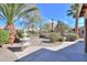 Scenic backyard with a fountain, mature trees, and manicured landscaping at 2408 E Fiesta Dr, Casa Grande, AZ 85194
