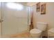 Bathroom featuring glass-enclosed shower, decorative vase, and neutral colors at 2408 E Fiesta Dr, Casa Grande, AZ 85194