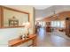Elegant entryway features tile flooring, a decorative mirror, and a view of the open-concept living space at 2408 E Fiesta Dr, Casa Grande, AZ 85194