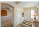 Inviting foyer features neutral tones, tile flooring, decorative accents, and a charming rug at 2408 E Fiesta Dr, Casa Grande, AZ 85194