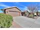 The home has a neutral exterior color, a large driveway, and desert landscaping at 2408 E Fiesta Dr, Casa Grande, AZ 85194