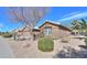 Well-maintained front yard with desert landscaping, including a leafy green bush at 2408 E Fiesta Dr, Casa Grande, AZ 85194