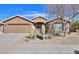 Beautiful desert landscaping with cacti and stone accents adorn the front yard at 2408 E Fiesta Dr, Casa Grande, AZ 85194