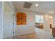 Hallway adorned with decorative wall art, light walls, and ceramic tile flooring at 2408 E Fiesta Dr, Casa Grande, AZ 85194