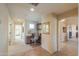Hallway featuring a built-in desk, neutral walls and carpet, with an adjacent sitting area at 2408 E Fiesta Dr, Casa Grande, AZ 85194