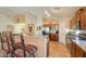 Open-concept kitchen with stainless steel appliances and breakfast bar, perfect for entertaining guests at 2408 E Fiesta Dr, Casa Grande, AZ 85194