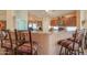 Eat-in kitchen with stainless steel appliances and cozy breakfast bar seating at 2408 E Fiesta Dr, Casa Grande, AZ 85194