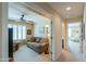 Welcoming living room with neutral tones, beamed entrance and plush seating at 2408 E Fiesta Dr, Casa Grande, AZ 85194
