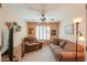 Living room features cozy seating, ceiling fan, and neutral decor at 2408 E Fiesta Dr, Casa Grande, AZ 85194
