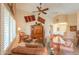 Inviting living room features vaulted ceiling, ceiling fan and warm toned walls at 2408 E Fiesta Dr, Casa Grande, AZ 85194