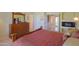 Well-lit main bedroom boasts plush bedding, warm colors, and a decorative fireplace at 2408 E Fiesta Dr, Casa Grande, AZ 85194