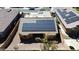 Aerial view of a home with solar panels on the roof in a residential neighborhood at 25564 W Magnolia St, Buckeye, AZ 85326