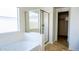 Light-filled bathroom with a glass-enclosed shower, soaking tub, and tile flooring at 25564 W Magnolia St, Buckeye, AZ 85326