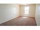 Bedroom with carpet, natural light, and neutral paint at 25564 W Magnolia St, Buckeye, AZ 85326