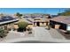 Single Gathering home with desert landscaping, driveway, and solar panels at 25564 W Magnolia St, Buckeye, AZ 85326