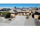 Single Gathering home with desert landscaping, driveway, and solar panels at 25564 W Magnolia St, Buckeye, AZ 85326