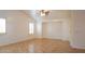 Open living room with tile flooring, ceiling fan, neutral paint, and natural light at 25564 W Magnolia St, Buckeye, AZ 85326