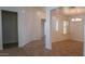 Open living room with tile flooring, neutral paint, and natural light at 25564 W Magnolia St, Buckeye, AZ 85326