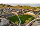 Lush green park with walking path offers a serene retreat with stunning views of the surrounding mountains at 27272 N 74Th Ln, Peoria, AZ 85383