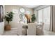Dining room with neutral tones, round mirrors and live plants at 27272 N 74Th Ln, Peoria, AZ 85383