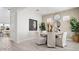 Bright dining room featuring a modern table, stylish chairs, and elegant decor at 27272 N 74Th Ln, Peoria, AZ 85383
