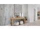 Hallway with rustic wood wall and stylish decor, creating a welcoming ambiance at 27272 N 74Th Ln, Peoria, AZ 85383