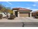 Charming single-story home with a well-maintained front yard, desert landscaping, and a two-car garage at 2910 W Allens Peak Dr, San Tan Valley, AZ 85144