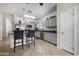Bright kitchen featuring stainless steel appliances, gray cabinets, and a breakfast bar with seating at 2910 W Allens Peak Dr, San Tan Valley, AZ 85144