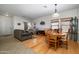 Inviting living and dining area featuring tile and wood flooring, neutral walls, and lots of natural light at 2910 W Allens Peak Dr, San Tan Valley, AZ 85144