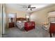 Serene main bedroom with carpet, ceiling fan, and lots of natural light at 2910 W Allens Peak Dr, San Tan Valley, AZ 85144