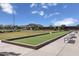 A well-manicured bocce ball court surrounded by lush greenery and comfortable seating in a community setting at 2966 E Bellerive Dr, Gilbert, AZ 85298