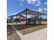 Community playground with shaded play structures, picnic area, and walking paths under a sunny sky at 2966 E Bellerive Dr, Gilbert, AZ 85298