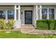 Elegant front entrance features a beautiful iron gate door and manicured landscaping at 3226 E Sells Dr, Phoenix, AZ 85018