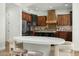 Spacious kitchen boasts custom wood cabinetry, stainless steel appliances, and a center island at 3226 E Sells Dr, Phoenix, AZ 85018