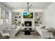 Bright and airy living room featuring a cozy fireplace, built-in shelves, and comfortable seating at 3226 E Sells Dr, Phoenix, AZ 85018