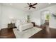 Serene bedroom boasts hardwood floors, a ceiling fan, and a neutral color palette at 3226 E Sells Dr, Phoenix, AZ 85018