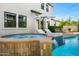 Beautiful pool area includes a stone-trimmed spa with waterfall and outdoor seating at 3226 E Sells Dr, Phoenix, AZ 85018