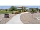Community park featuring a playground, covered picnic area, and lush green space at 36503 W San Ildefanso Ave, Maricopa, AZ 85138