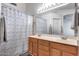 Bathroom featuring a double sink vanity and shower with neutral colors and updated features at 3702 W Megan St, Chandler, AZ 85226