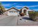 Inviting single-story home with a two-car garage and well-maintained desert landscaping in the front yard at 3702 W Megan St, Chandler, AZ 85226