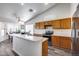 Open kitchen featuring a large island, stainless appliances, and modern flooring at 3702 W Megan St, Chandler, AZ 85226