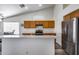 Kitchen featuring a large island, stainless appliances, and modern flooring at 3702 W Megan St, Chandler, AZ 85226