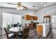 Bright kitchen with stainless steel appliances, a breakfast bar, and a cozy eat-in area at 3702 W Megan St, Chandler, AZ 85226