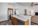 Bright kitchen features a breakfast bar with wood cabinets, light countertops and stainless steel appliances at 3702 W Megan St, Chandler, AZ 85226