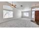 Bright and open living room with large windows offering plenty of natural light at 3702 W Megan St, Chandler, AZ 85226