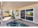 Covered patio with views of the backyard, multiple windows, and a sliding glass door at 3702 W Megan St, Chandler, AZ 85226