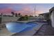 Sparkling private pool in a fenced backyard oasis with lush greenery and desert landscaping at 3702 W Megan St, Chandler, AZ 85226