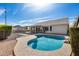 Relaxing backyard pool with deck, privacy fence, mature shrubs and a patio area at 3702 W Megan St, Chandler, AZ 85226
